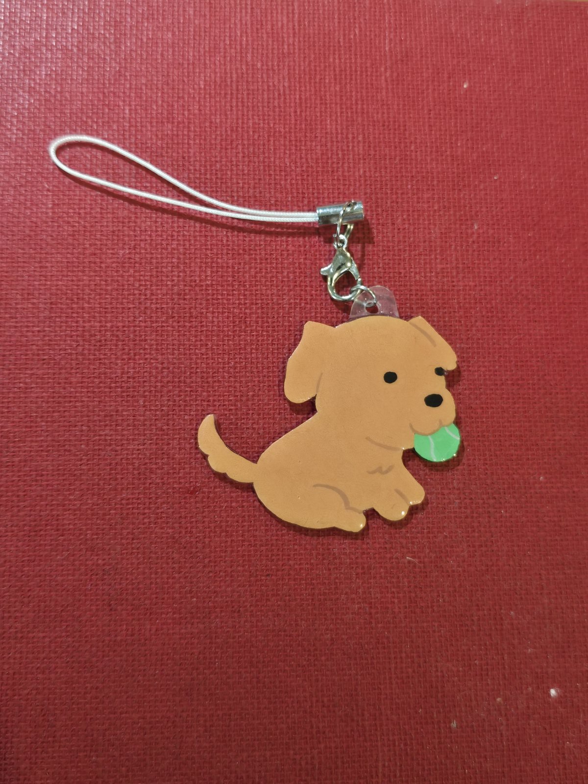 The finished golden retriever charm keychain with its clasp and cord attached