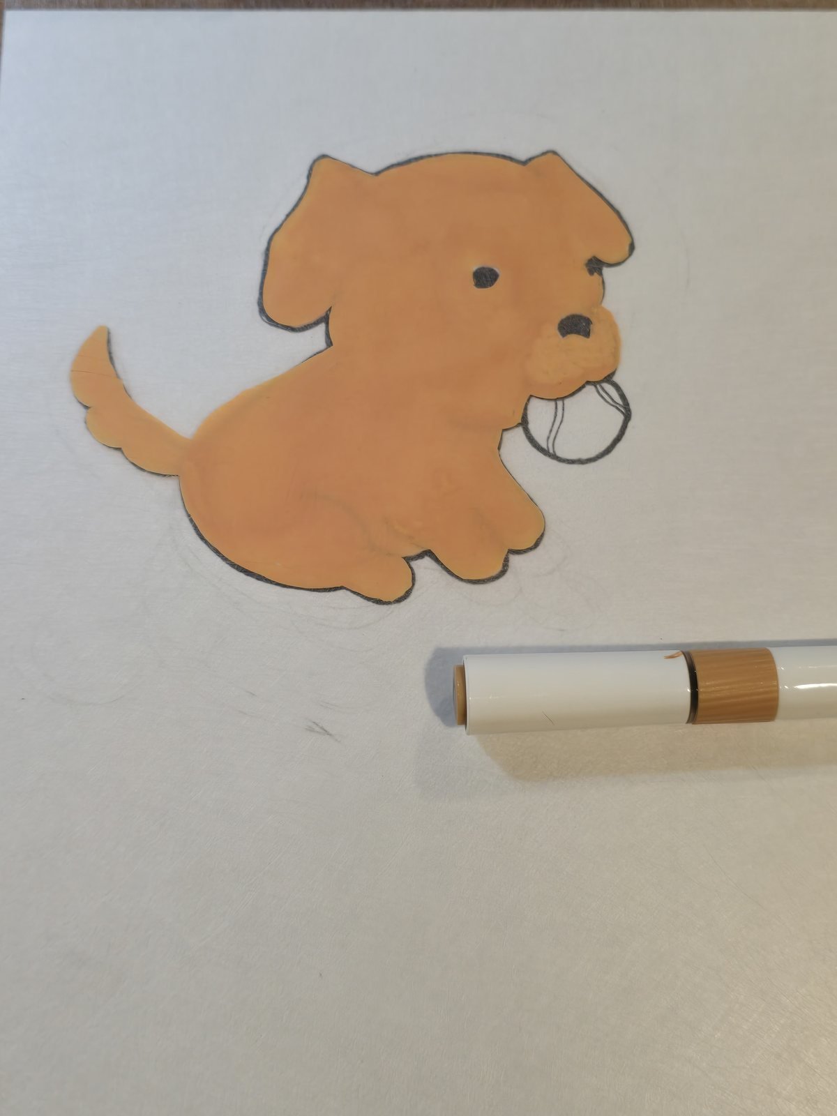 The design partway through coloring, with the body filled in tan but the tennis ball still uncolored